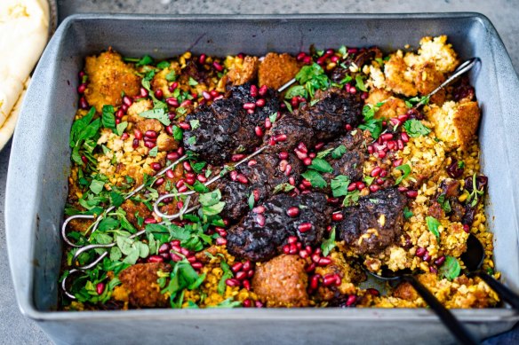 Middle Eastern one-tray wonder with lamb koftas, torn falafel and a bed of dates and grains.