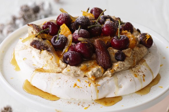 Adam Liaw's Christmas pudding inspired pavlova with spiced brandy-spiked cream.