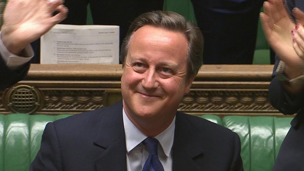 David Cameron smiles amid applause during his final session of prime minister's questions at the House of Commons.