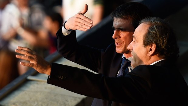 French Prime Minister Manuel Valls and UEFA President Michel Platini (right) talk prior to the UEFA Champions League final.