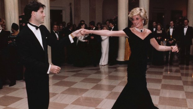 Actor John Travolta dances with Princess Diana at a White House dinner in Washington in 1985.