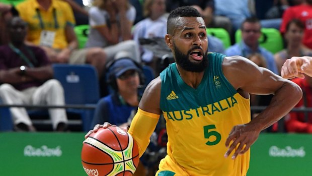 Top of their Games: Patty Mills drives forward for the Boomers. 