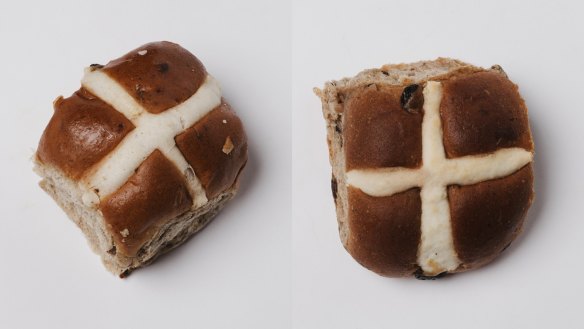 Hot cross buns from Coles (left) and Bakers Delight.