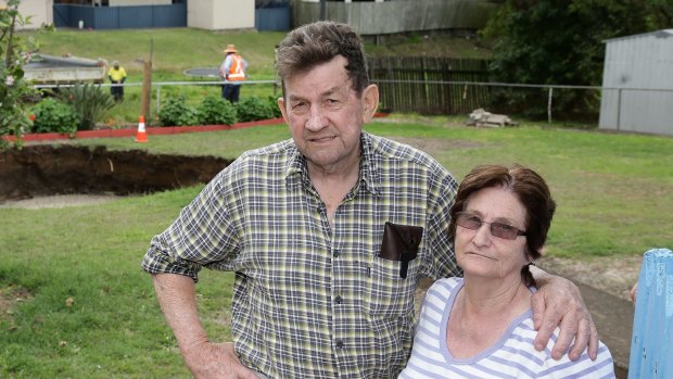 Residents Ray and Lynn McKay after a massive sinkhole opened in the backyard of their Ipswich home.