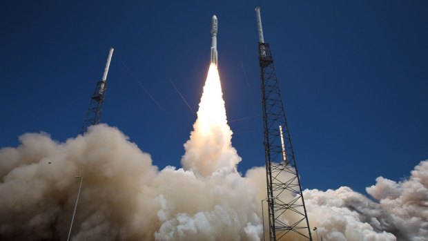 An Atlas V rocket blasts off on Wednesday carrying three Australian designed mini-satellites.