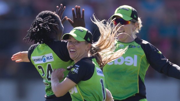 Positive start: Sydney Thunder celebrate their victory over the Renegades.