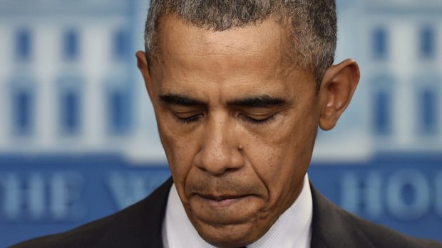 President Barack Obama pauses as he speaks about the shooting at the community college in Oregon. 