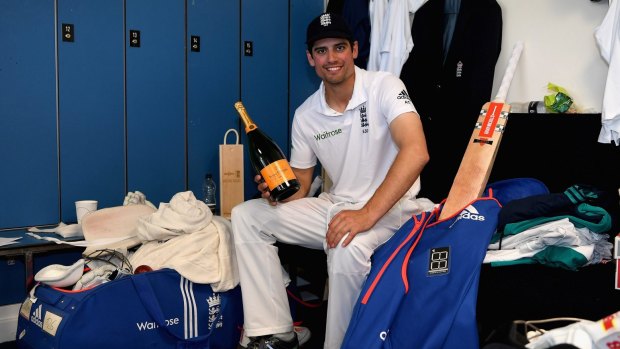 Milestone man: England skipper Alastair Cook celebrates reaching 10,000 Test runs.