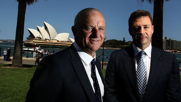 New deal: Graham Arnold with Sydney FC chairman Scott Barlow after signing a new contract.