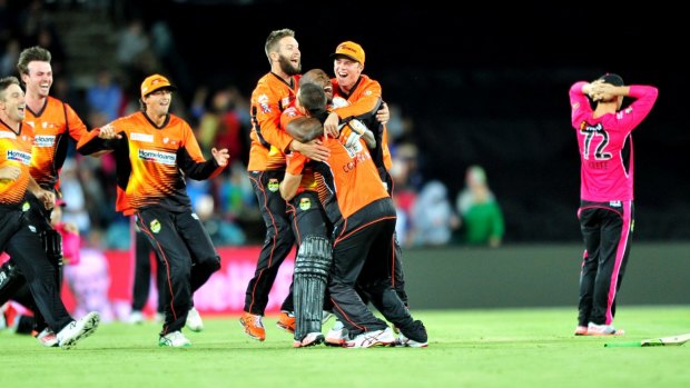 Winners are grinners: Perth players celebrate their win in the Big Bash final.