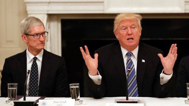 A new-found bromance: "Tim Cook is a great guy, the head of Apple," Trump said this week. The photo shows the pair at the since disbanded Technology Council at the White House last year.