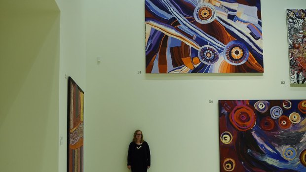 Sense of energy and activity: Curator Anne Ryan surrounded by paintings in the central exhibition gallery of the Art Gallery of NSW.