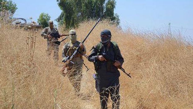 Islamic State militants on patrol in Khazer, Iraq, last month.