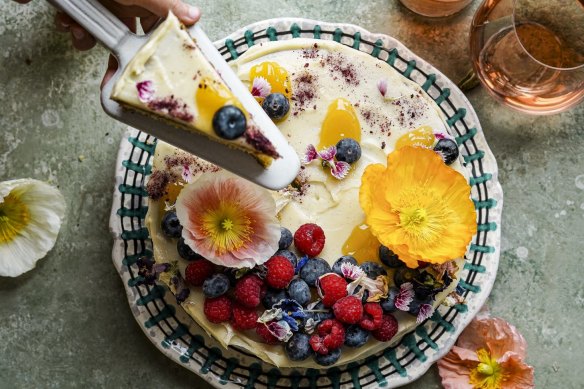 Ice and then decorate this cake with flowers and berries of your choice.