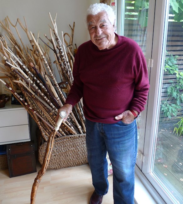 Chef and restaurateur Antonio Carluccio, with his collection of walking sticks he has carved from hazel branches, something he's done all of his life. Each includes a mushroom carved into the top.
