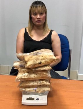 An Australian woman born in Vietnam has been arrested allegedly with 1.8 kilograms of heroin hidden in a suitcase case at Phnom Penh's international airport. 