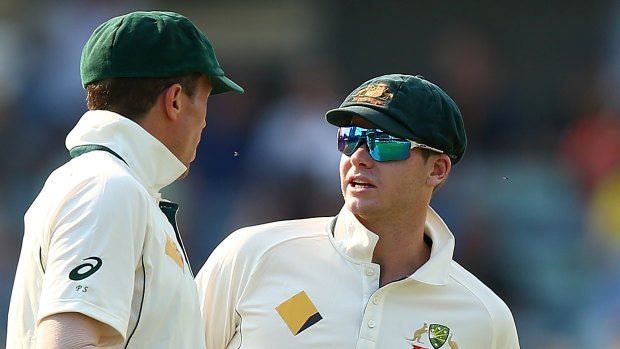 Got the answers?: Peter Siddle chats with Steve Smith.