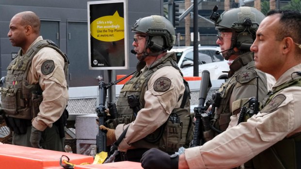 Los Angeles County Sheriff's deputies on guard at the Universal City Red Line station in Los Angeles.