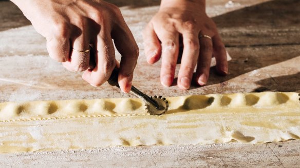 Shaping the agnolotti.