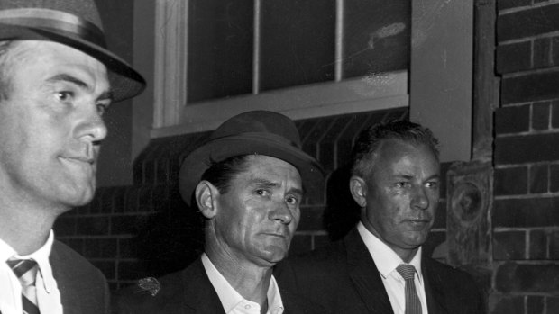 Melbourne prison escapee Ronald Ryan being taken to police headquarters in Sydney after his recapture on January 5, 1966. He was executed in 1967.