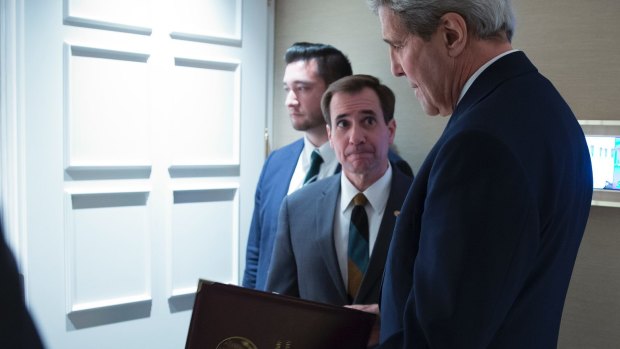 State Department spokesman John Kirby, seen speaking with Secretary of State John Kerry (right), has conceded that the US timed  repayments to Iran around release of three prisoners. 