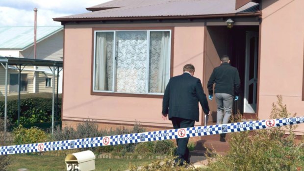 Police at the Oberon home where the boy was killed. 