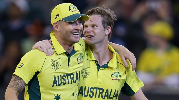 Local heroes: Michael Clarke and Steve Smith arm in arm after guiding Australia to victory.