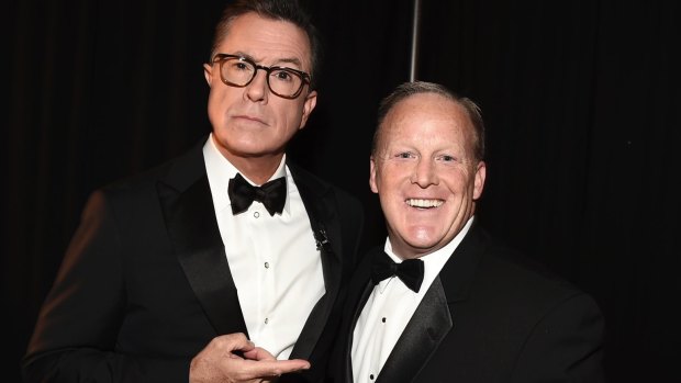 Stephen Colbert, left, and Sean Spicer pose backstage at the 69th Primetime Emmy Awards.