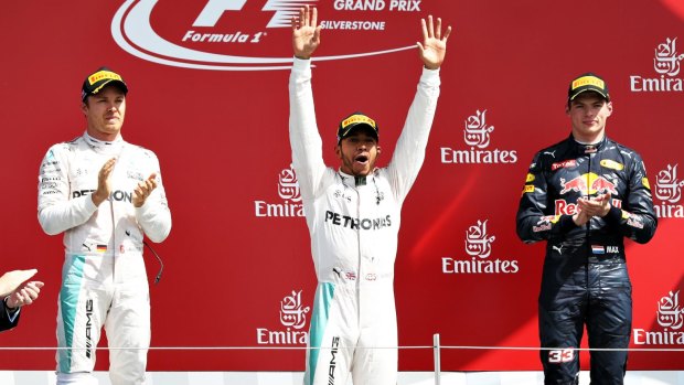 Lewis Hamilton (centre) on the podium with Nico Rosberg and  Max Verstappen.