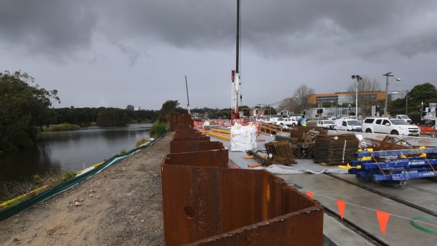 Flood mitigation works at the Centennial Park pond, which is now considered a dam.