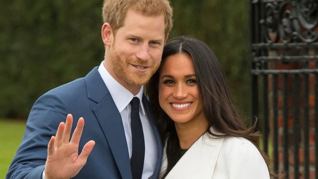 Britain's Prince Harry and Meghan Markle pose for photos after announcing their engagement.