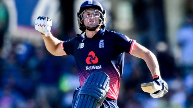 Destructive innings: Jos Buttler leaps for joy after posting his century.