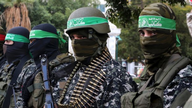 Masked militants from the Izzedine al-Qassam Brigades, a military wing of Hamas.