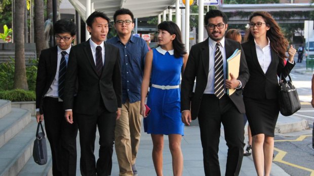 University of Queensland student Ai Takagi and former student Yang Kaiheng with their legal team earlier in the case.