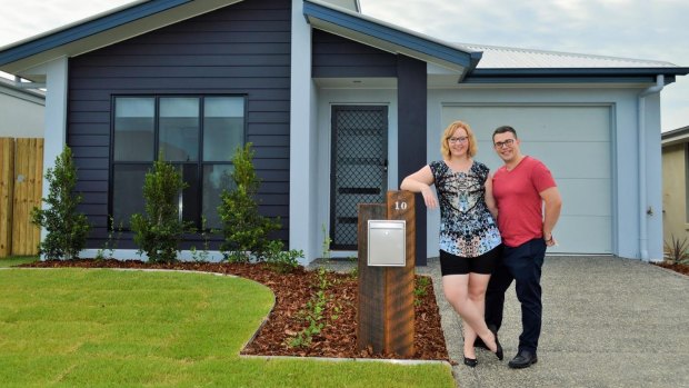 Amy and James Lewis; Aura's first residents in their new suburb of Baringa.