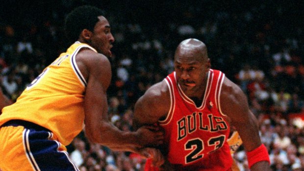 Back in the day: Kobe Bryant defends Michael Jordan during a Lakers-Bulls clash in 1998.