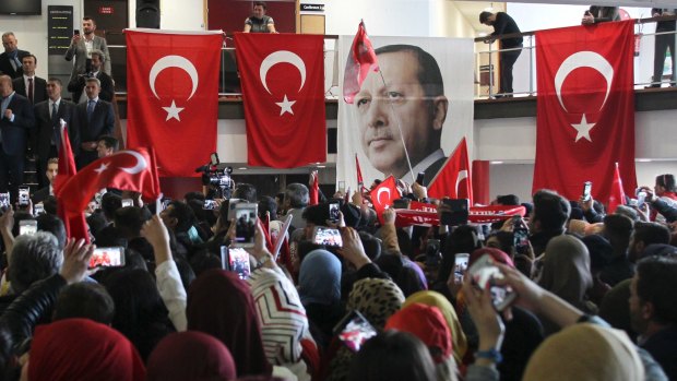Pictures of Turkey's President Recep Tayyip Erdogan at a rally in Metz, France on Sunday where Turkish Foreign Minister Mevlut Cavusoglu was speaking.