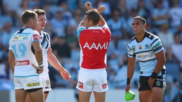 On report: Referee Grant Atkins reprimands Greg Bird. 