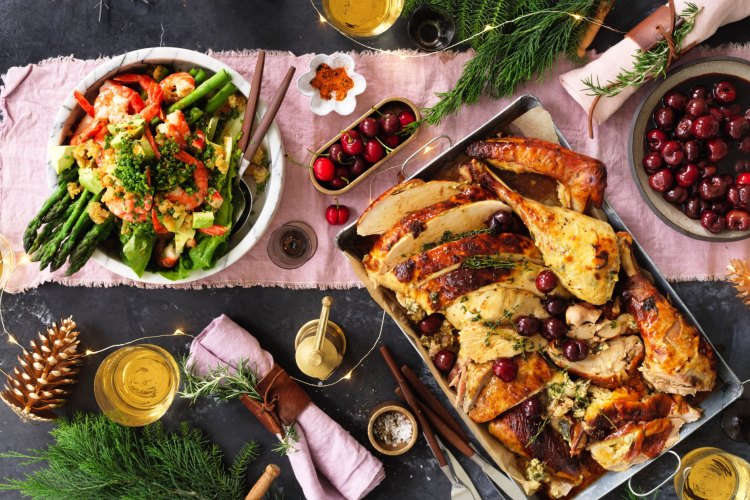 Neil Perry's king prawn asparagus and avocado salad (left) and roast turkey with ricotta stuffing.