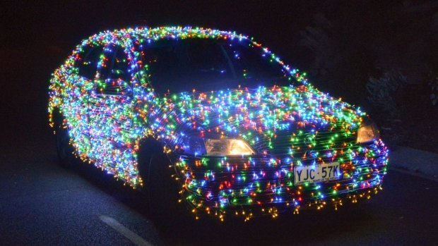 Jordan Wallace has rigged his car with 10,000 lights to spread Christmas cheer throughout Canberra