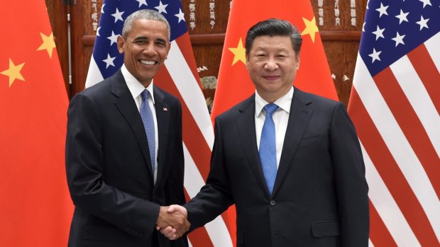 US President Barack Obama and Chinese President Xi Jinping shake hands before their meeting at the West Lake State Guest House in Hangzhou.