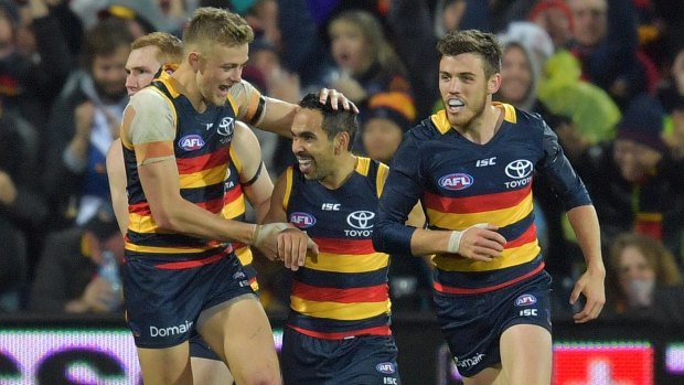 Livewire: Eddie Betts is congratulated after scoring one of his three majors.
