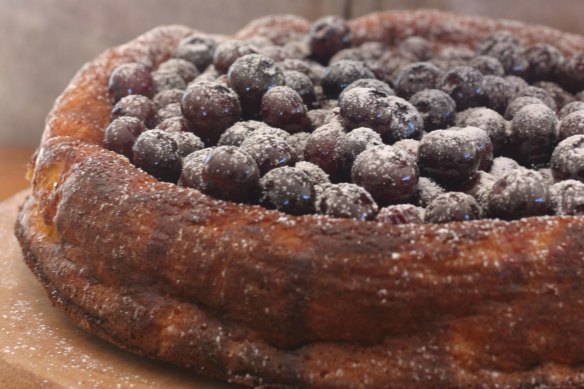 Orange and almond cake topped with blueberry compote.