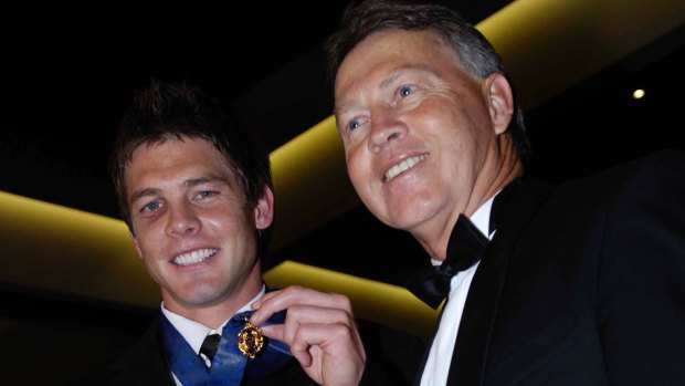 Father and son: Ben Cousins and his father Bryan after being awarded the Brownlow Medal in 2005.
