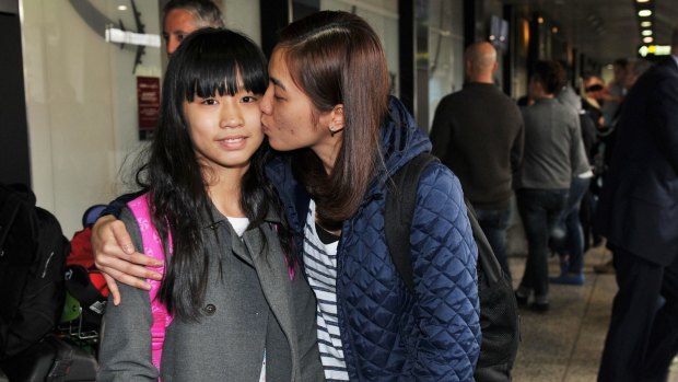 Stranded 11-year-old Kate Vo and her mother Duong Nguyen arrive at Melbourne airport from Ho Chi Minh city.