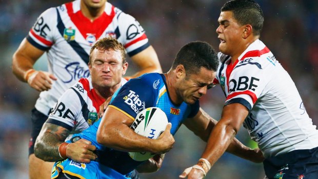 Gaining match fitness: Jarryd Hayne is wrapped up by the Roosters. 