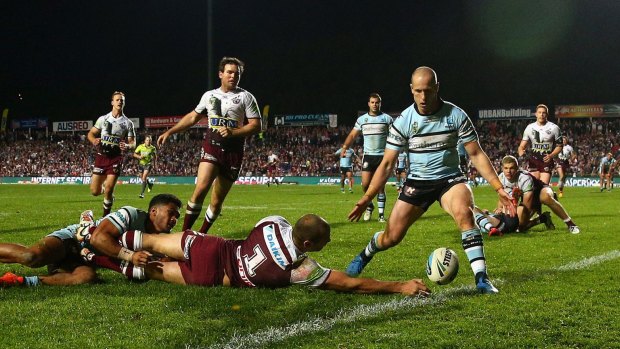 Manly's Brett Stewart attempts to score a try against the Sharks at Brookvale oval last month.