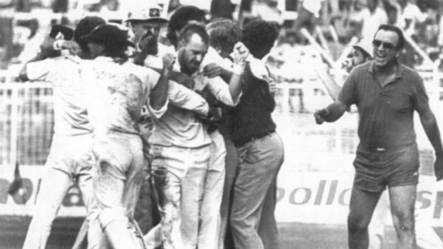 Thrilling finish: Bob Simpson, the only person to have participated in two tied Tests, runs onto the field to congratulate last-over hero Greg Matthews after he had Maninder Singh LBW and tied the 1986 Madras Test. 
