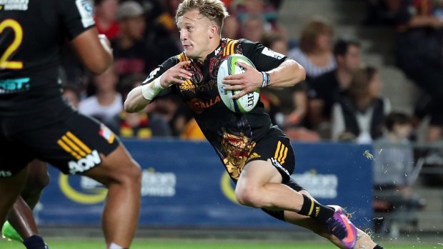 Damian McKenzie of the Chiefs steps through the Bulls defence.