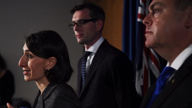 The Premier Gladys Berejiklian will have responsibility for a list of UrbanGrowth projects. The Minister for Planning and Housing Anthony Roberts (right) has responsibility for Landcom.